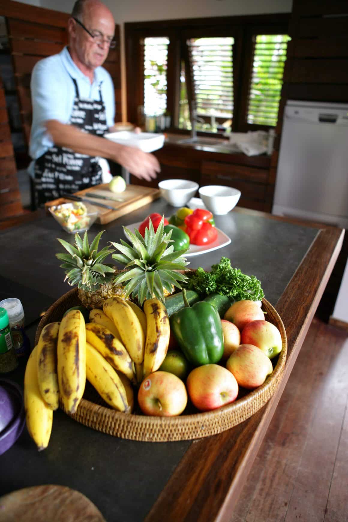 A man is preparing food in a kitchen.